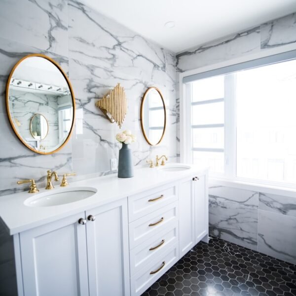 Elegant double sink bathroom with marble countertops and dual mirrors
