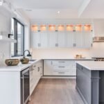 Clean white shaker kitchen cabinets with bright interior