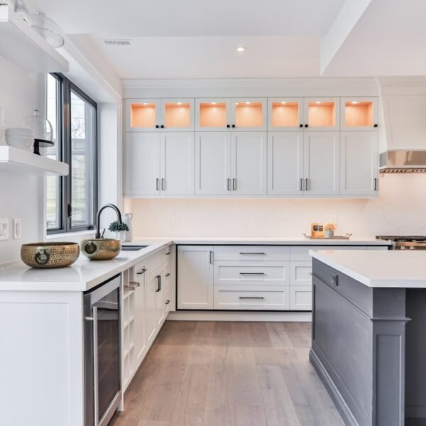 Clean white shaker kitchen cabinets with bright interior