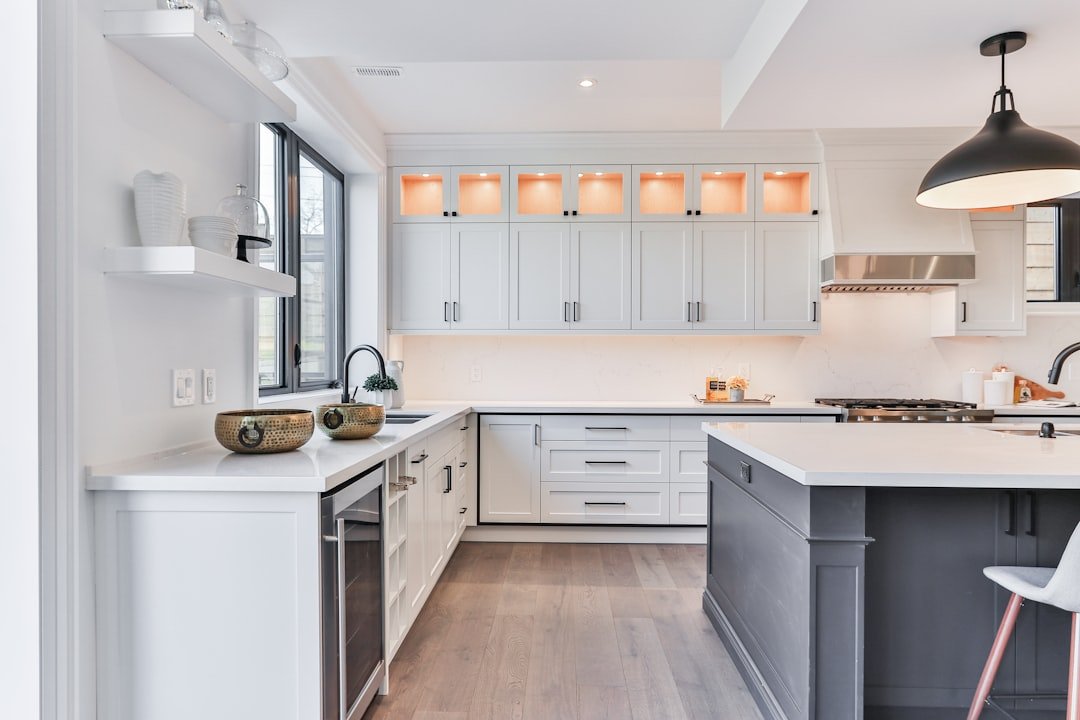 Clean white shaker kitchen cabinets with bright interior