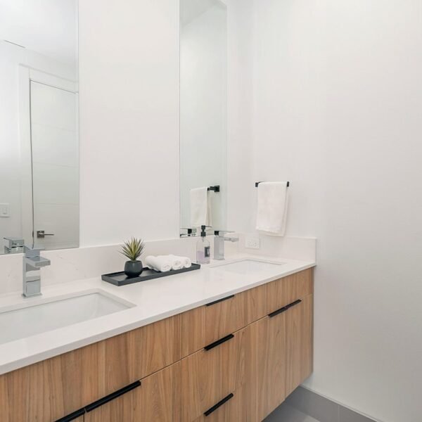 Modern single bathroom vanity with white cabinet and mirror