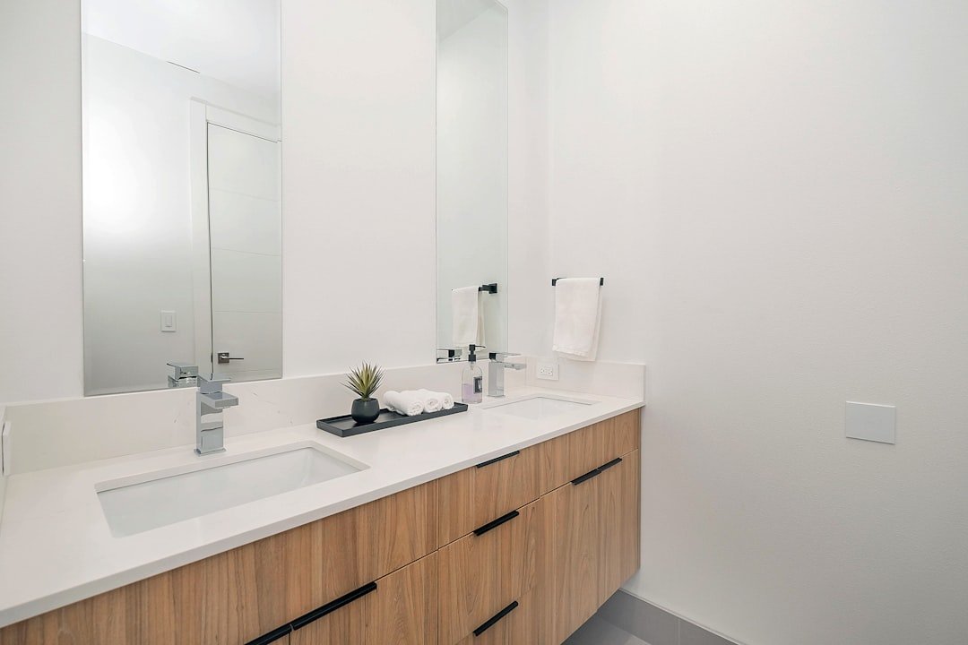 Modern single bathroom vanity with white cabinet and mirror